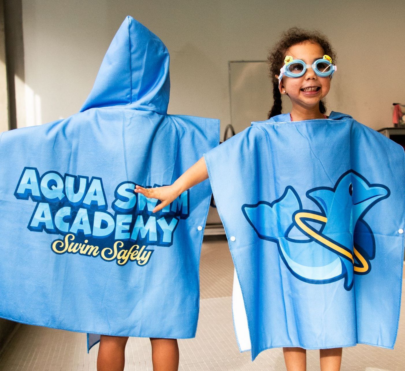 Aqua Swim Academy swimmers in branded gear
